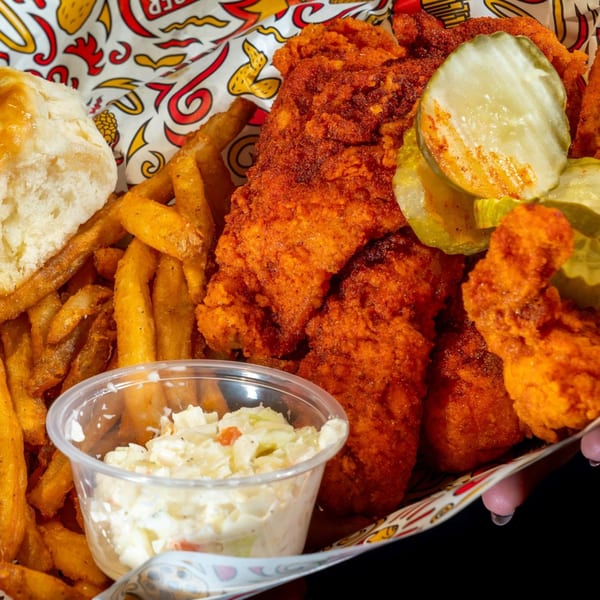 Holy Buckets Halal Chicken & Chicken meal with spicy fried chicken, fries, biscuit, coleslaw, and pickles.